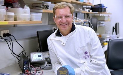Professor Matt Trau from UQ’s AIBN has been awarded an ARC Laureate Fellowship A scientist wearing a lab coat and holding a piece of equipment